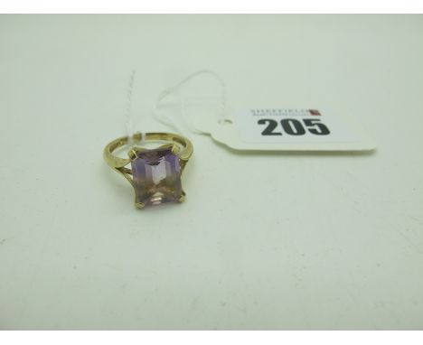 A Modern 9ct Gold Single Stone Dress Ring, rectangular four claw set (finger size N) (2.7grams). 