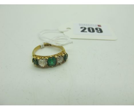 An 18ct Gold Emerald and Diamond Five Stone Ring, claw set with old cut diamonds, Birmingham 1903 (finger size L).