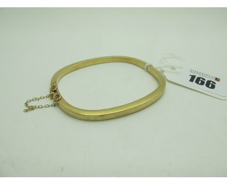 A Modern 9ct Gold Hinged Bangle, of plain design (10grams). 