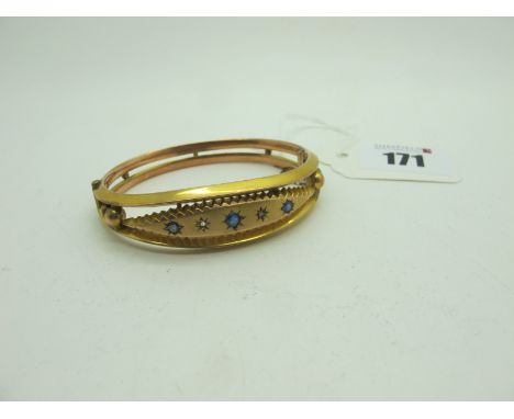 A Chester Hallmarked 9ct Gold Hinged Bangle, graduated star set to the front, hinged to snap clasp, Chester 1906 (11.5grams).