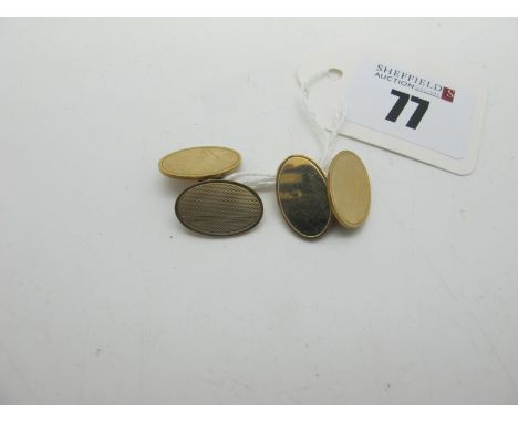 A Pair of 9ct Gold Cufflinks, the oval panels part engine turned, on chain connections (8grams). 