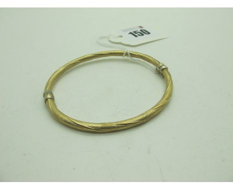A Decorative Hinged Bangle, allover textured finish (sprung hinge) stamped "375" (4grams). 