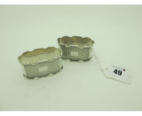 A Pair of Decorative Hallmarked Silver Napkin Rings, allover engine turned decoration. (2) 