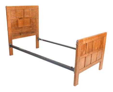 Robert Mouseman Thompson (1876-1955): An English Oak 3ft Single Panelled Bedstead, with penny moulded tops, the footboard wit