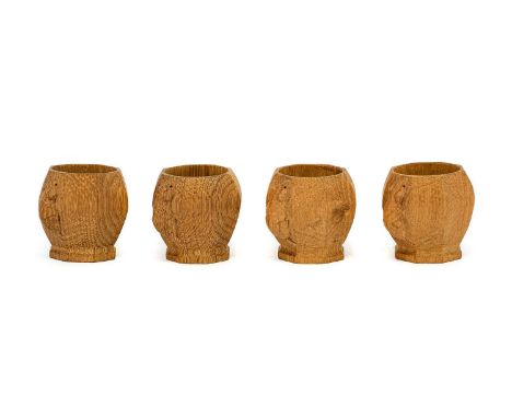 Workshop of Robert Mouseman Thompson (Kilburn): A Set of Four English Oak Egg Cups, of octagonal form, each with carved mouse