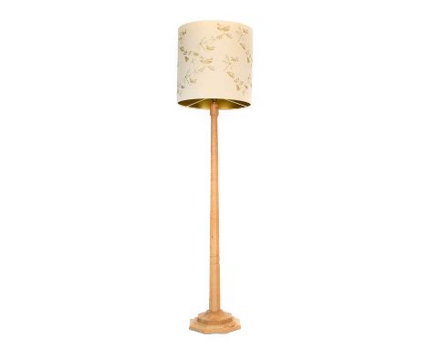 Workshop of Robert Mouseman Thompson (Kilburn): An English Oak Standard Lamp, octagonal column and base, with carved mouse tr