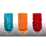 Whitefriars - Geoffrey Baxter: A Trio of Textured Range Cylindrical Bark Glass Vases, in ruby,