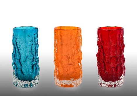 Whitefriars - Geoffrey Baxter: A Trio of Textured Range Cylindrical Bark Glass Vases, in ruby, tangerine and kingfisher blue,