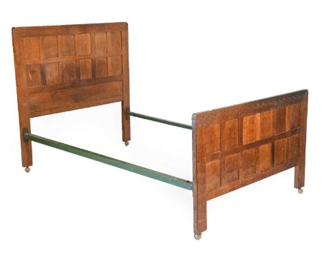 Robert Mouseman Thompson (1876-1955): An English Oak 4ft Bedstead, with penny moulded tops, with carved mouse trademark, 124.