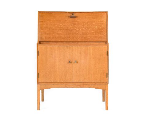 Tom Lupton &amp; John Morton at LM Furniture Ltd: A Mid Century Oak Bureau, the fall front with open fitted interior, above t