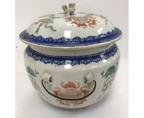 A late 19th Century Chinese kamcheng, the cover with dog of Fo finial within a band of bat, ribbon and medallion decoration, 