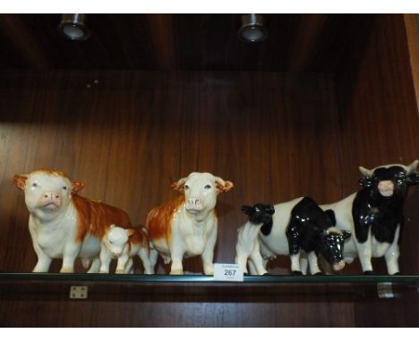 TWO CERAMIC CATTLE FAMILY GROUPS