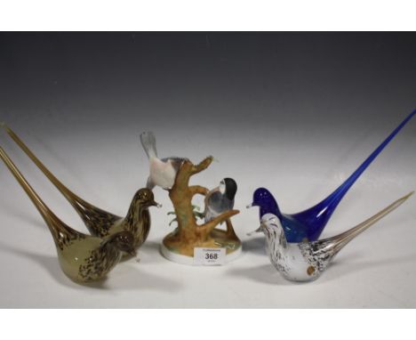 A CROWN STAFFORDSHIRE HAND PAINTED CERAMIC 'CHICKADEE' FIGURE, TOGETHER WITH FOUR WEDGWOOD STUDIO GLASS BIRD SHAPED PAPERWEIG
