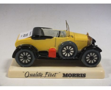 A CARLTONWARE HAND PAINTED BULL NOSE MORRIS 'QUALITY FIRST FIGURE'