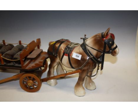 A CERAMIC HORSE AND CART FIGURE 