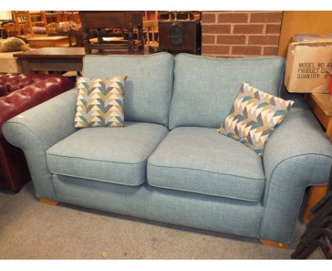 A MODERN GREY/BLUE UPHOLSTERED TWO SEATER SOFA