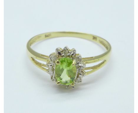 A 9ct gold, peridot and diamond ring, 1.1g, O