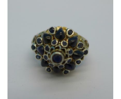 A 14ct gold and sapphire cluster ring, 5.7g, N