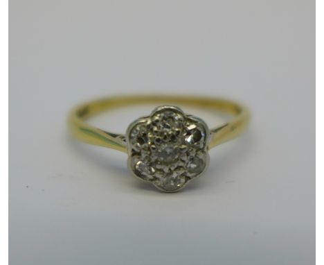 An 18ct gold, platinum and diamond daisy cluster ring, 2.2g, P