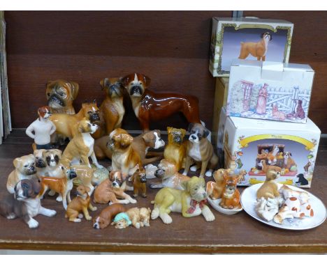 A large collection of boxer dog figures, four boxed, Coopercraft, Szeiler, Border Fine Arts and Goebel