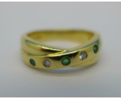 An 18ct gold, emerald and diamond crossover ring, 6.4g, N