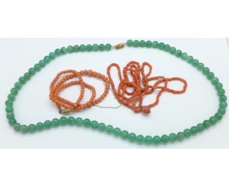 Two coral necklets and a jade necklet