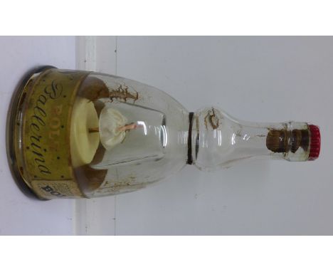 A musical Bols decanter lacking contents