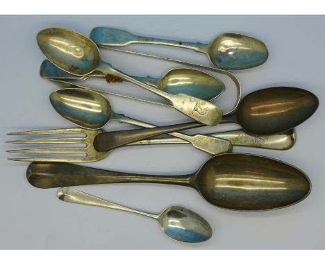Eight silver spoons, a silver fork and a pair of silver sugar bows, mainly 19th Century, 302g