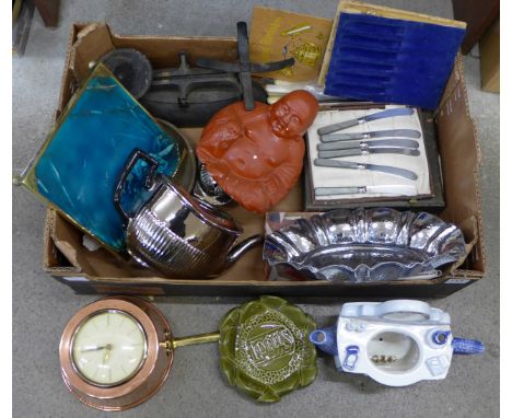 A box of assorted items including a mounted Minton tile, a/f, a copper 'pan' mounted Westclox clock, flatware, scales and wei