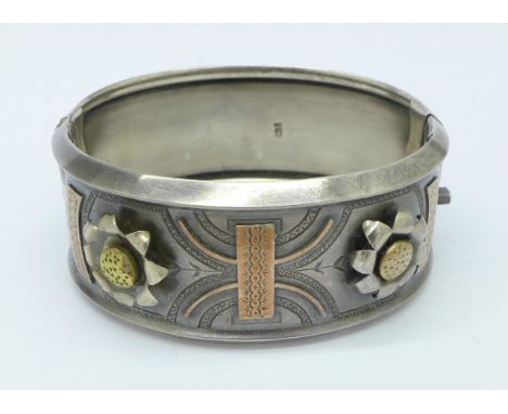 A Victorian silver bangle with applied gold decoration, Birmingham 1876, Payton, Pepper & Co.