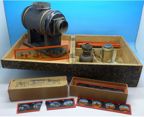 A boxed magic lantern with a box of slides and loose slides, marked Made in Germany on box