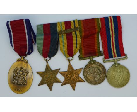 A set of four WWII medals to 134806 F. De Villiers with 8th Army badge and a John Chard medal, boxed