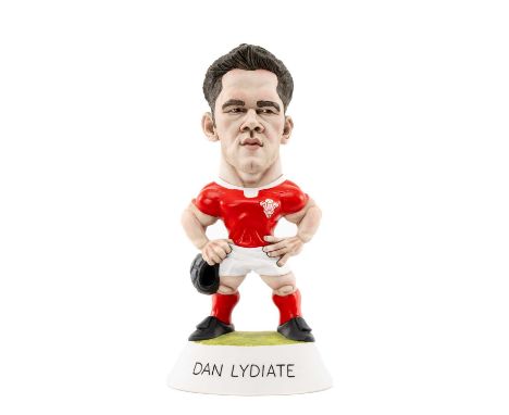 RUGBY UNION CLUB HOUSE: THE WORLD OF GROGGS Dan Lydiate in Welsh kit carrying scrum cap, limited edition (11/500), inscribed 
