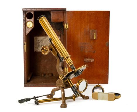 SCIENCE CLUB HOUSE: NEGRETTI & ZAMBRA LACQUERED BRASS MICROSCOPE, with moveable stage, magnifying lens on arm and stand, comb