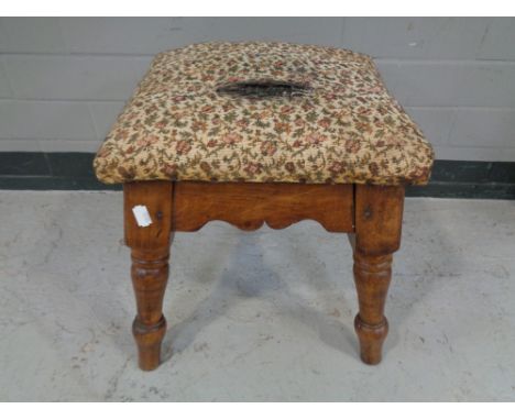 An Edwardian tapestry upholstered foot stool.  