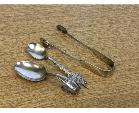 A silver caddy spoon, together with silver sugar tongs and a continental silver crested spoon. (3)