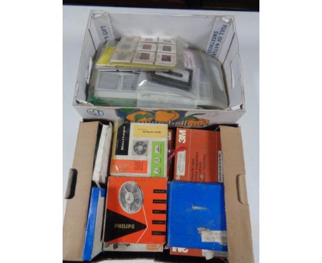 Two boxes of vintage film reels and projector slides