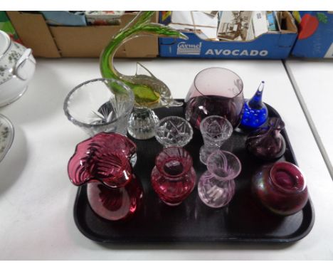 A tray containing assorted glassware to include Venetian glass fish, Caithness glass vases, a tear drop paperweight, cranberr