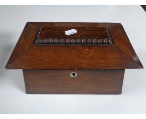 A Victorian rosewood tea caddy