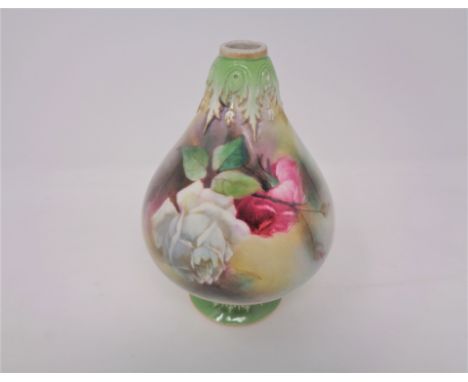 A late 19th century hand painted Royal Worcester bulbous vase, depicting roses, height 16 cm 