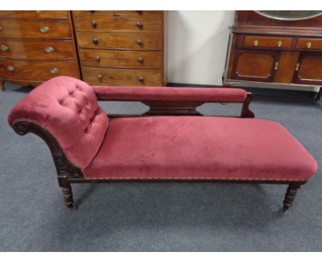 A late 19th century mahogany framed chaise lounge upholstered in a maroon button draylon.  