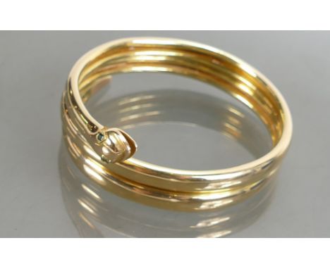 Gold coloured metal Bangle 49.6g: Tested as 9ct gold, expanding snake bangle set with 2 green stones in eyes.  Likely to have