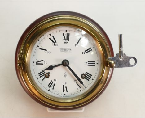 Wempe Chronometerwerke Hamburg brass Ships clock: On a wood base with striking bell movement, diameter 16cm.