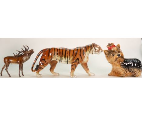 Goebel figures to include: A large Bengal tiger, Yorkshire terrier and a moose. (3) Condition Report: moose has 1 antler A/F