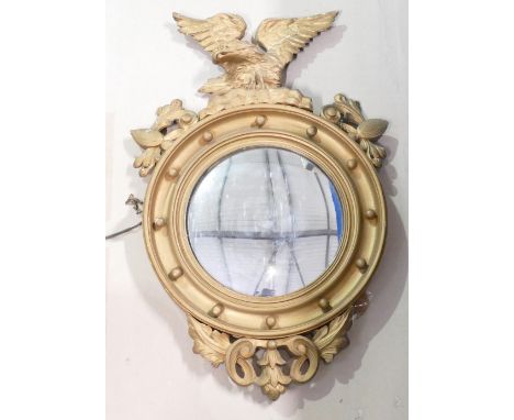 20th century convex Wall mirror: In gilt ball frame with eagle finial, height 84cm. Condition Report: damage noted to eagles 