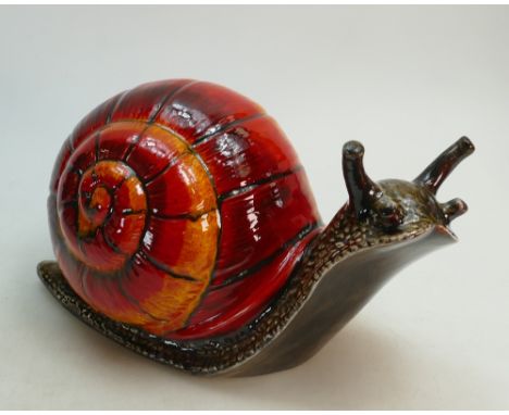 Anita Harris Art pottery model of a Snail: In orange/ brown colourway, height 21cm x 39cm long.