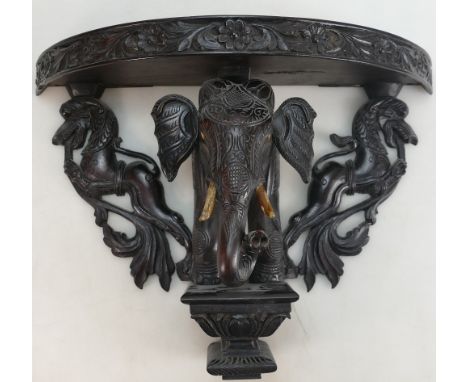 Indonesian Carved Hardwood Shelf: Marked V Shumuqam Asari, Sinqaratope Street, Madura,  in the form of an elephant.