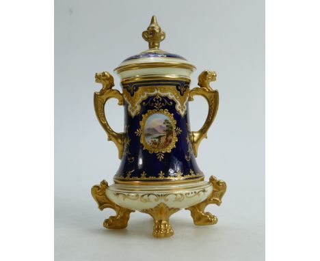 Coalport gilded and hand painted two handled Urn &amp; cover: Decorated with a loch scene, height 18cm (restoration to lid fi