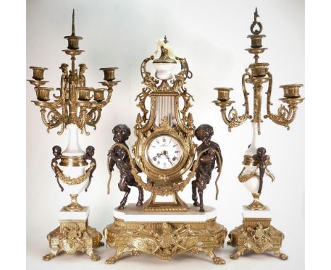 Italian Rococo Style gilt metal and marble clock Garniture set:  Bronzed Cherubs with gilt mountings, height of tallest 67cm.