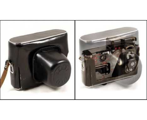 UNIQUE Spy Camera Disguised - as a CAMERA! On casual glance this appears to be a normal Zenith E camera it it's case, but ope